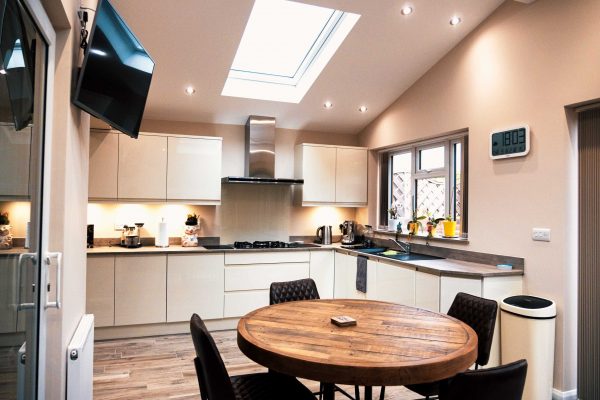 Galley style kitchen - fitted in Kingswinford. Gloss porcelain & handle-less